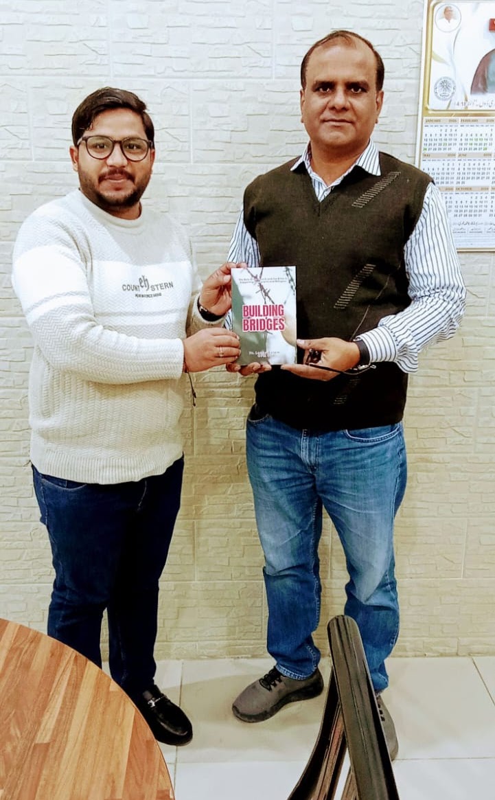 Presenting the book to fellow friars