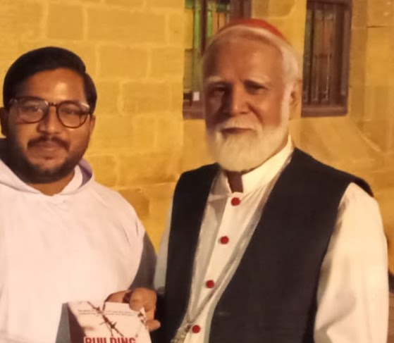 Presenting the book to Cardinal Joseph Coutts